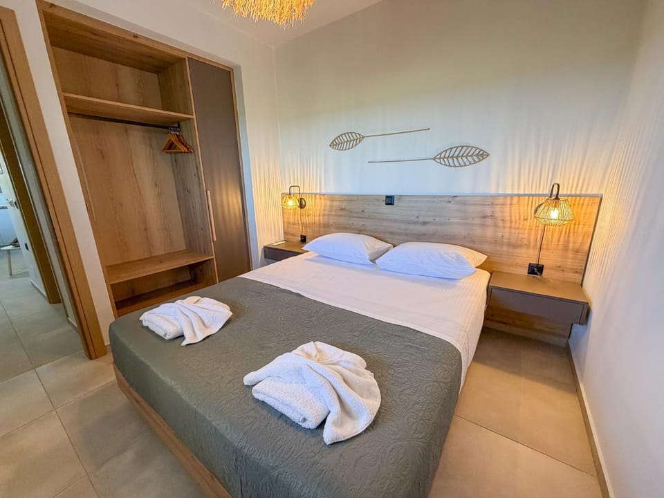 Bed, towels, wardrobe