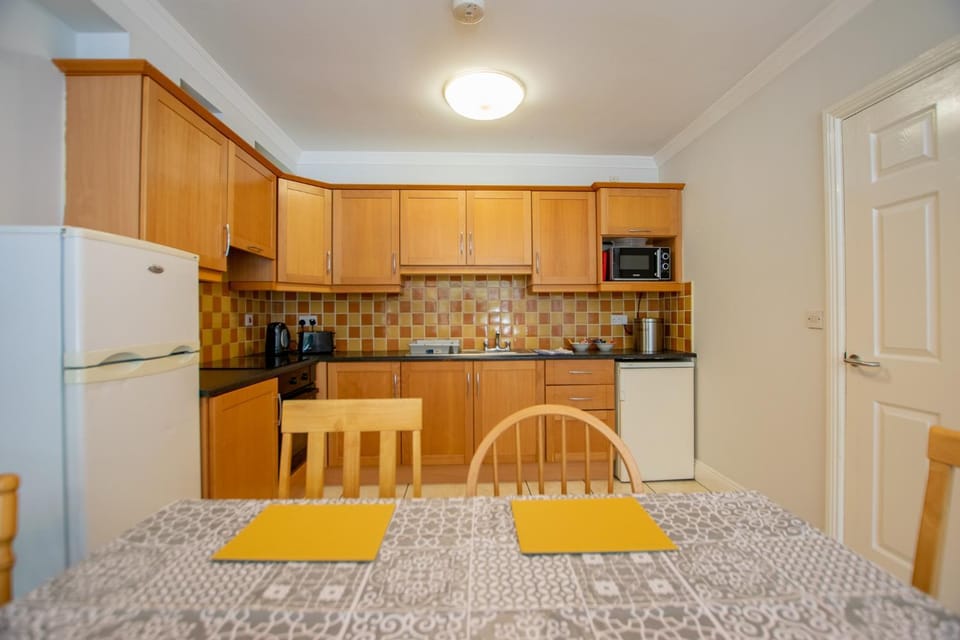 Kitchen or kitchenette, oven, stove