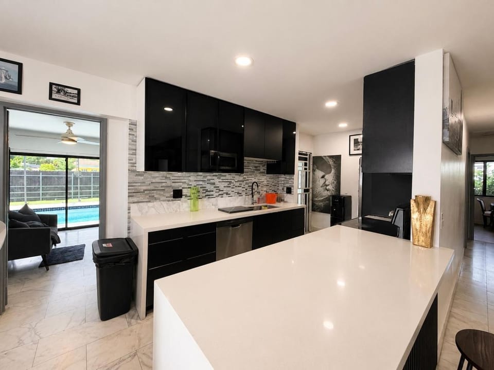 Kitchen or kitchenette, dishwasher, oven, stove
