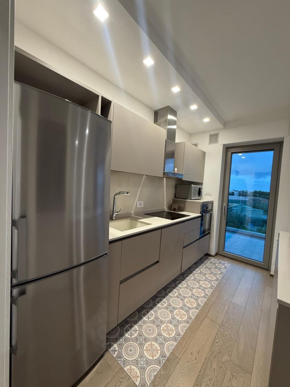 Kitchen or kitchenette, dishwasher, oven, stove