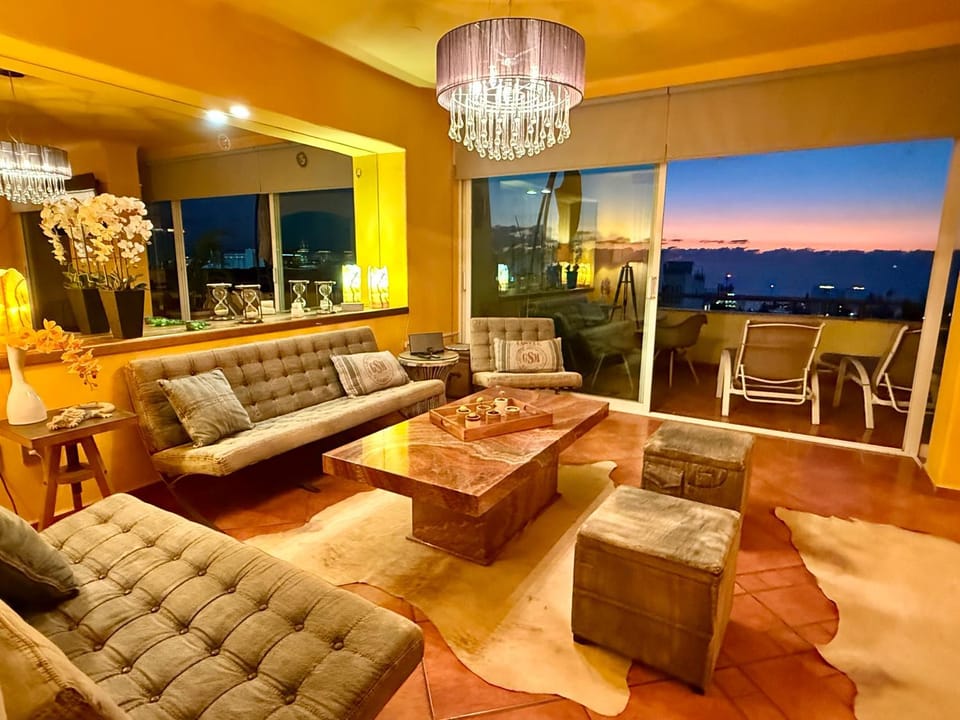 Natural landscape, View (from property/room), Living room, Seating area, Sea view