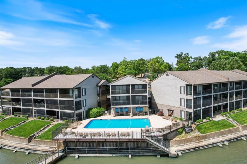 Property building, Day, Natural landscape, Pool view, Swimming pool, Swimming pool, sunbed