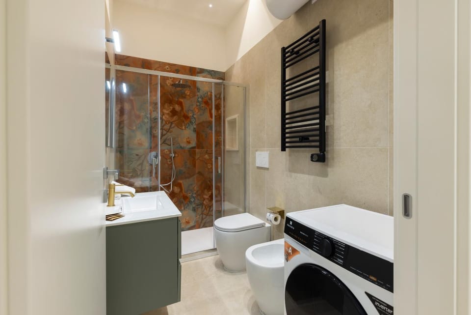 Shower, Toilet, Bathroom, bidet, hair dryier, towels, towels, washing machine, dryer