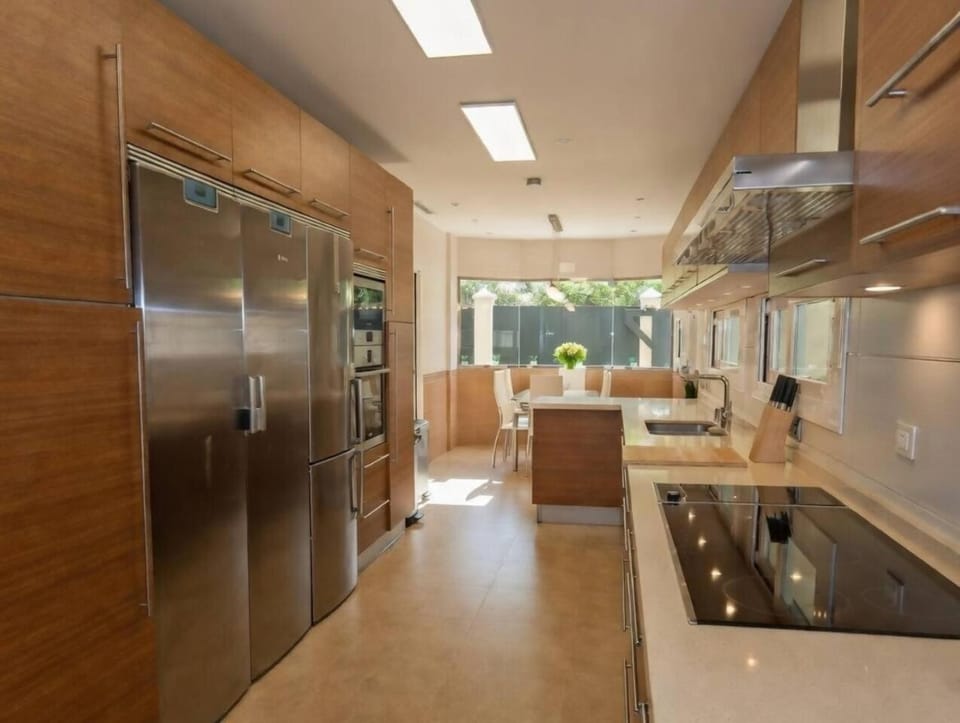 Kitchen or kitchenette, dishwasher, oven, stove