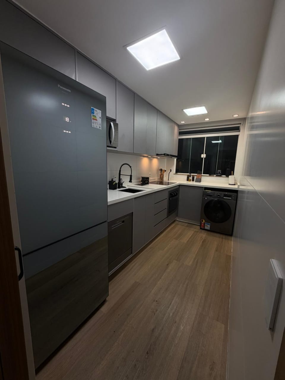 dishwasher, microwave, minibar, oven, stove, laundry, kitchen