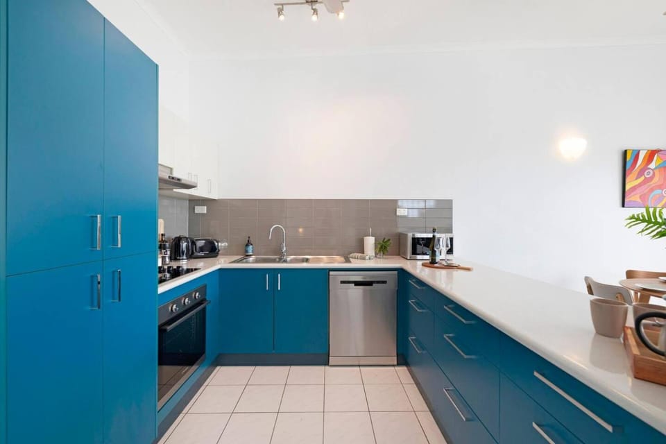 Kitchen or kitchenette, dishwasher, oven, stove