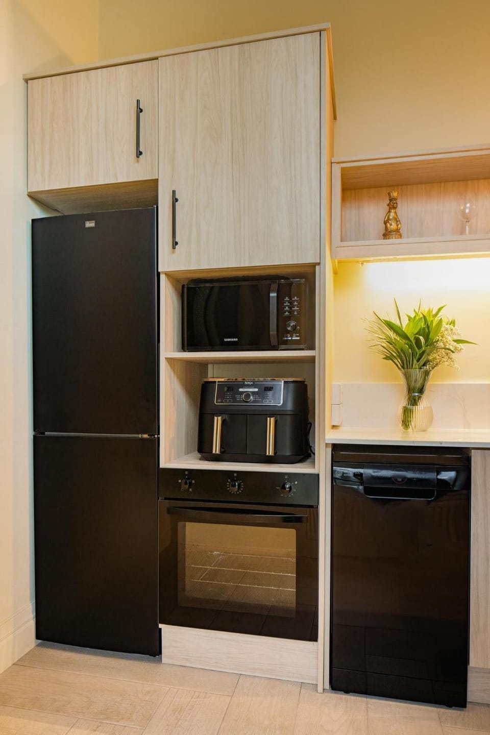 Kitchen or kitchenette, dishwasher, microwave, oven