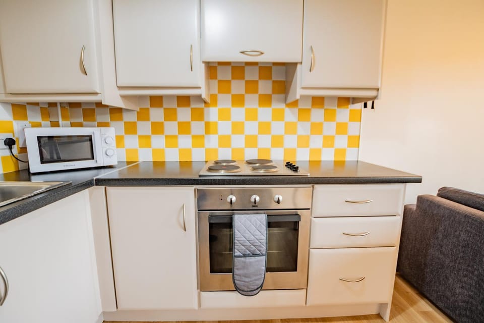 Kitchen or kitchenette, oven, stove, toaster