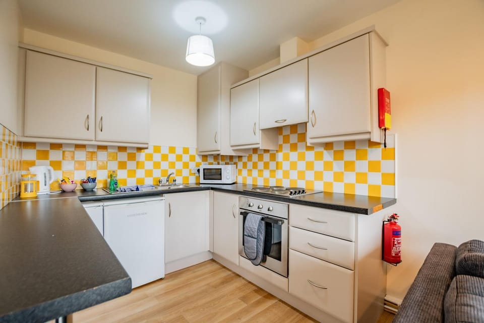 Kitchen or kitchenette, oven, stove, toaster