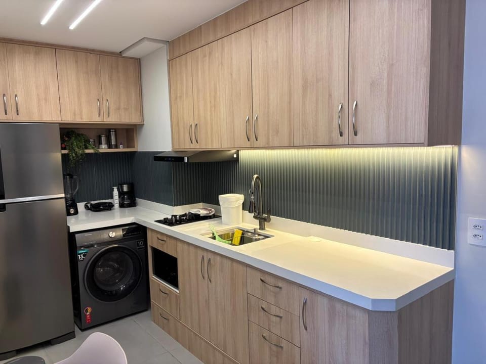 Kitchen or kitchenette, oven, stove, toaster, washing machine, dryer