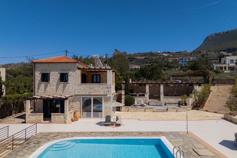 Property building, Patio, Pool view, Swimming pool, sunbed