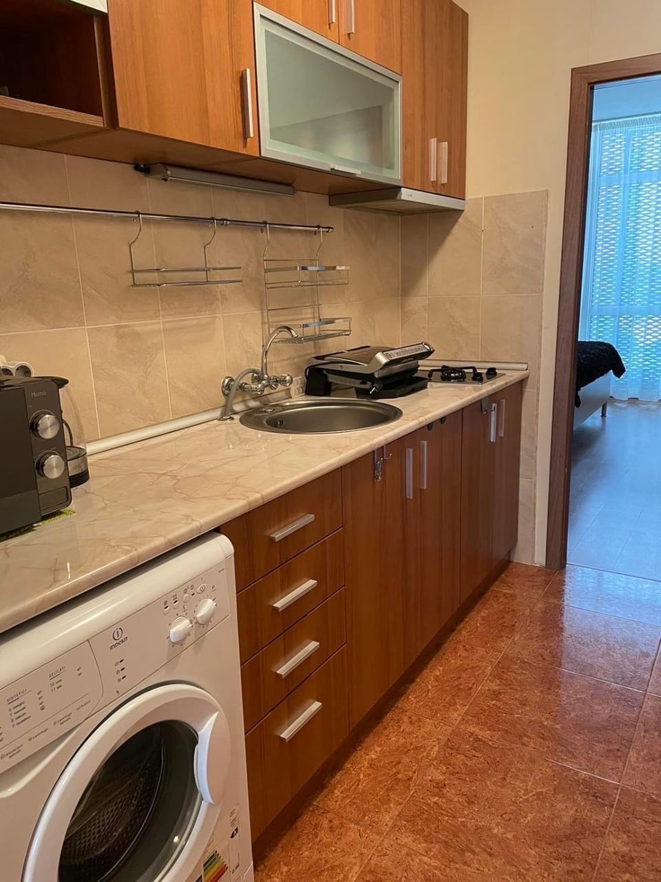Kitchen or kitchenette, stove, washing machine