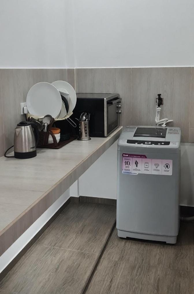 Kitchen or kitchenette, washing machine