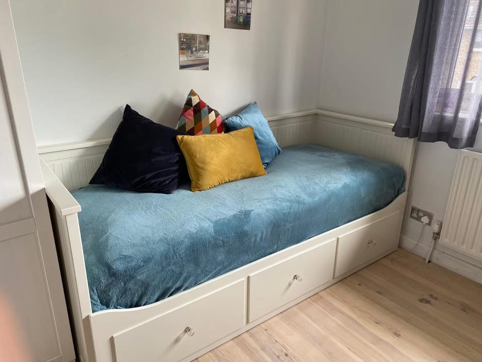Bed, Living room, Seating area, Bedroom