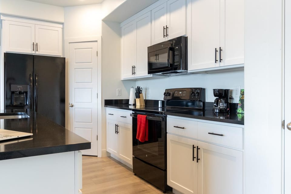 Kitchen or kitchenette, dishwasher, oven, stove, toaster