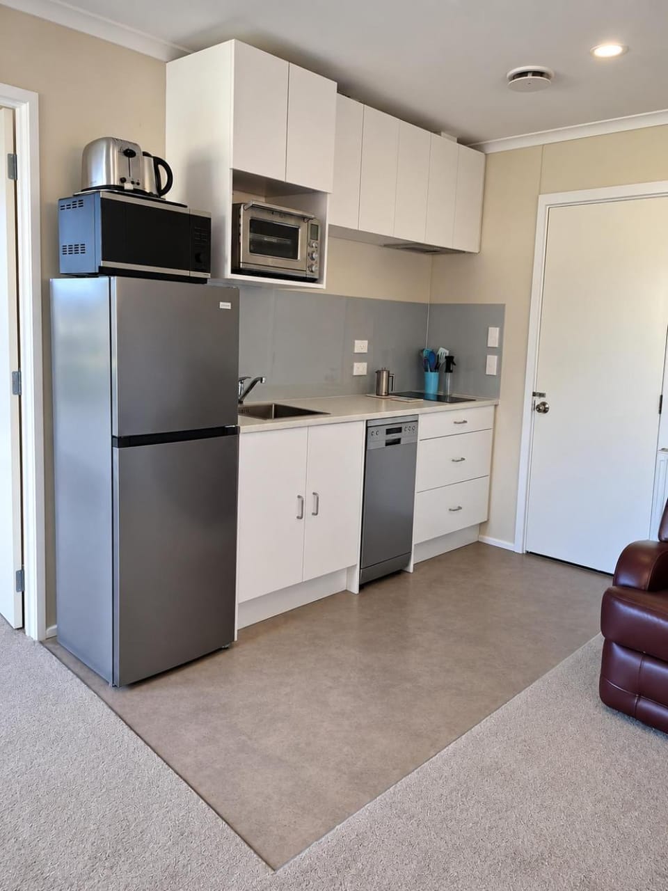 Kitchen or kitchenette, dishwasher, stove, toaster