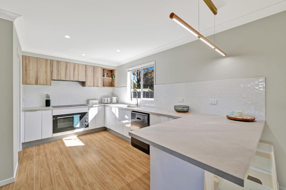 Kitchen or kitchenette, dishwasher, oven, stove, toaster