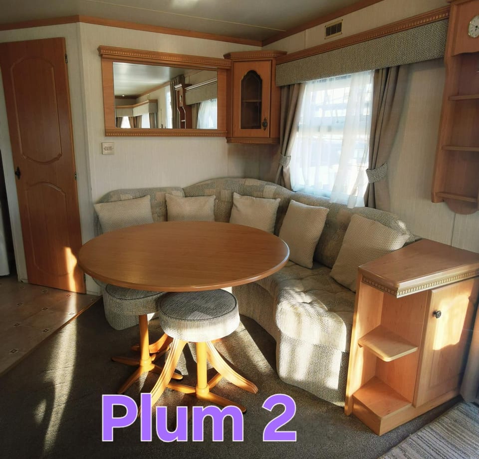 Plum 2 a 3 bed 8 berth luxury and spacious static caravan with large wrap around secure veranda and central heating, fresh bedding provided, peaceful and very cosy plot on Coral Beach in Ingoldmells House in Ingoldmells