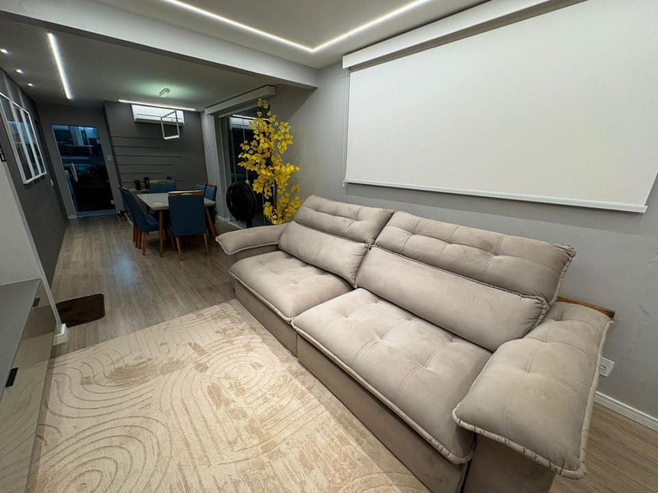 Bed, TV and multimedia, Living room, Seating area, air conditioner