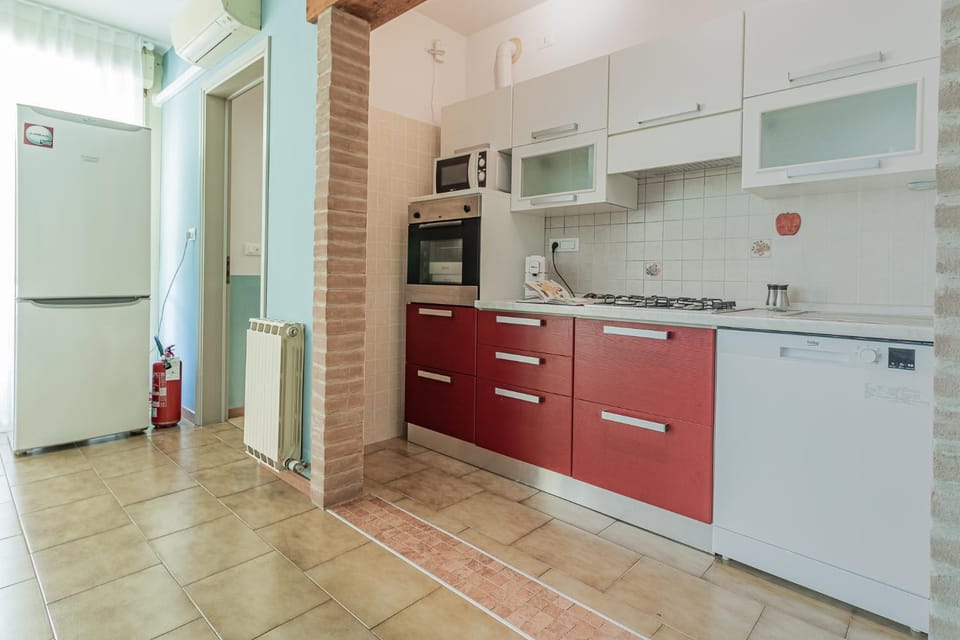 Kitchen or kitchenette, dishwasher, oven, stove