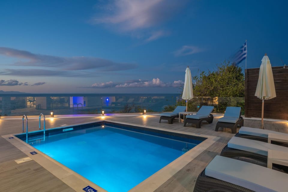 Property building, Patio, Natural landscape, Pool view, Sea view, Swimming pool, sunbed