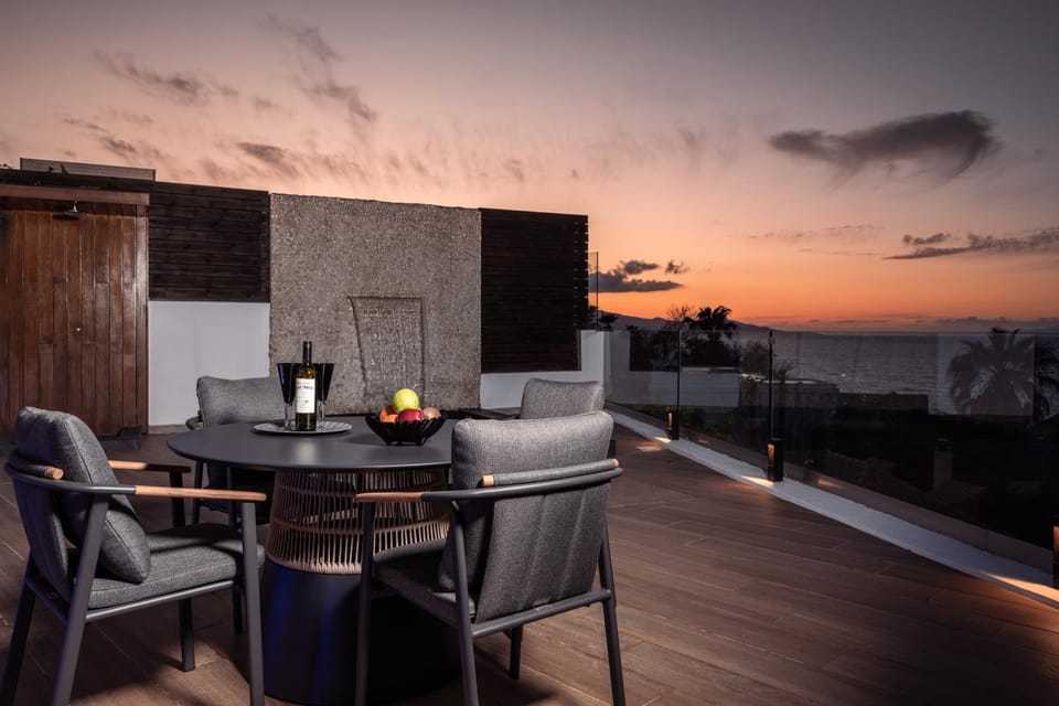 Property building, Patio, Natural landscape, View (from property/room), Balcony/Terrace, Seating area, Dining area, Sea view, Sunset
