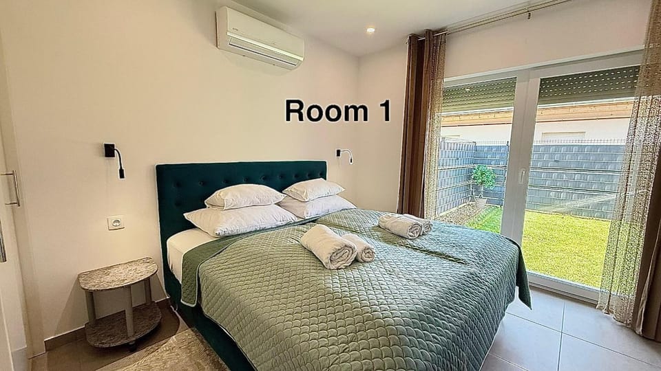 Bed, Garden view, towels, wardrobe, air conditioner