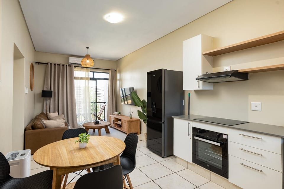 TV and multimedia, Balcony/Terrace, Photo of the whole room, Dining area, furniture, oven, stove, kitchen, air conditioner