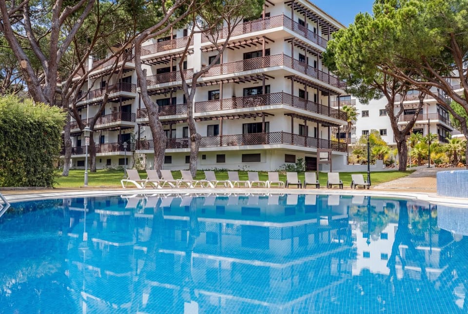 Property building, Day, Natural landscape, Pool view, Swimming pool, Swimming pool, sunbed