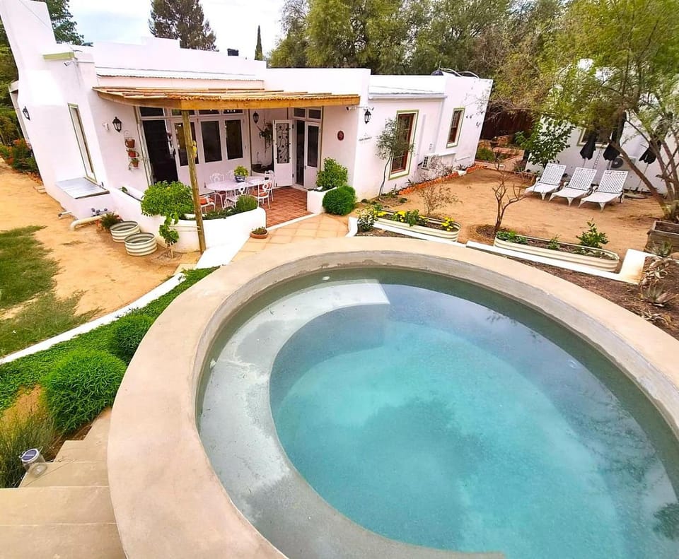 Property building, Patio, Natural landscape, Pool view, Swimming pool, sunbed