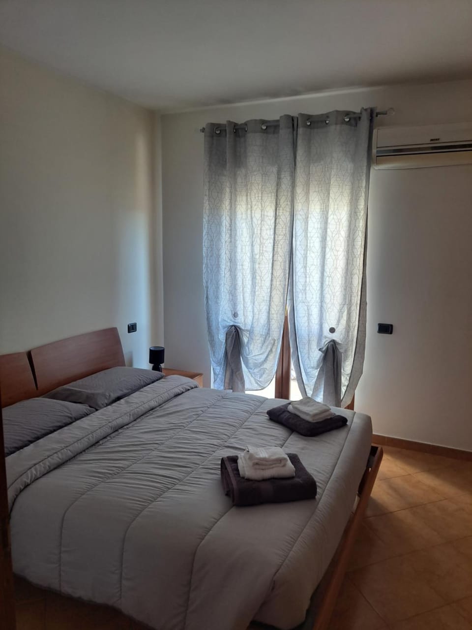 Bed, Photo of the whole room, Bedroom, towels, air conditioner