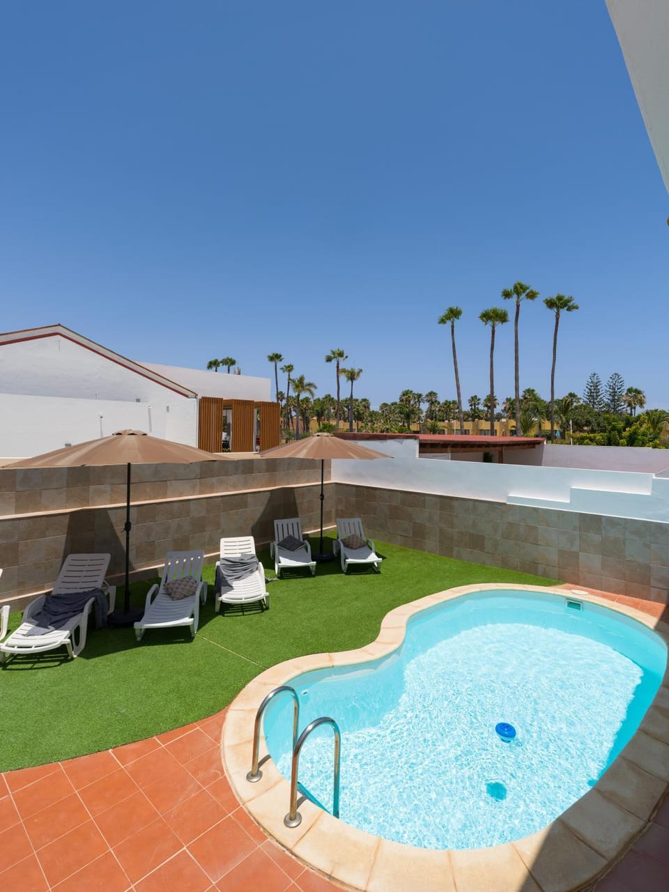 Patio, Day, Natural landscape, Pool view, Swimming pool, sunbed