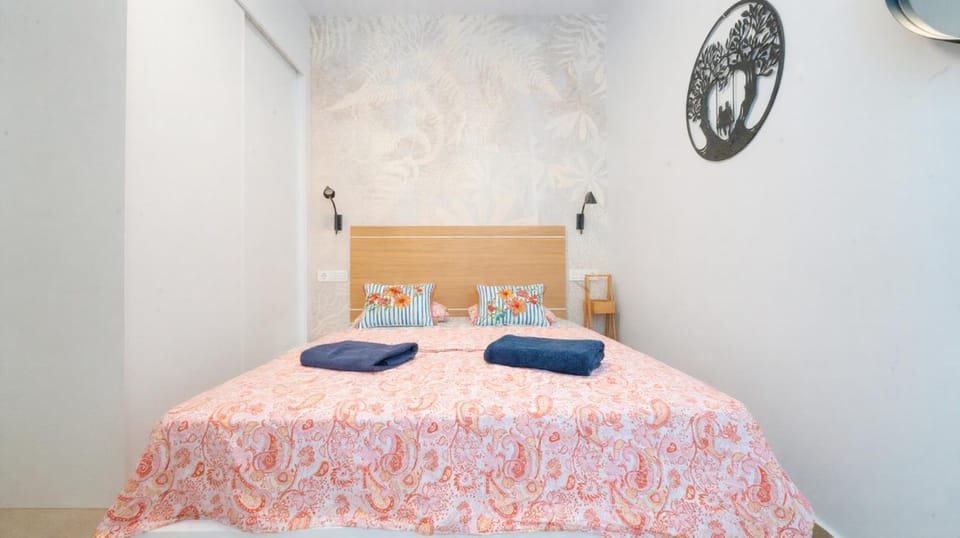 Bed, flat iron, towels, wardrobe