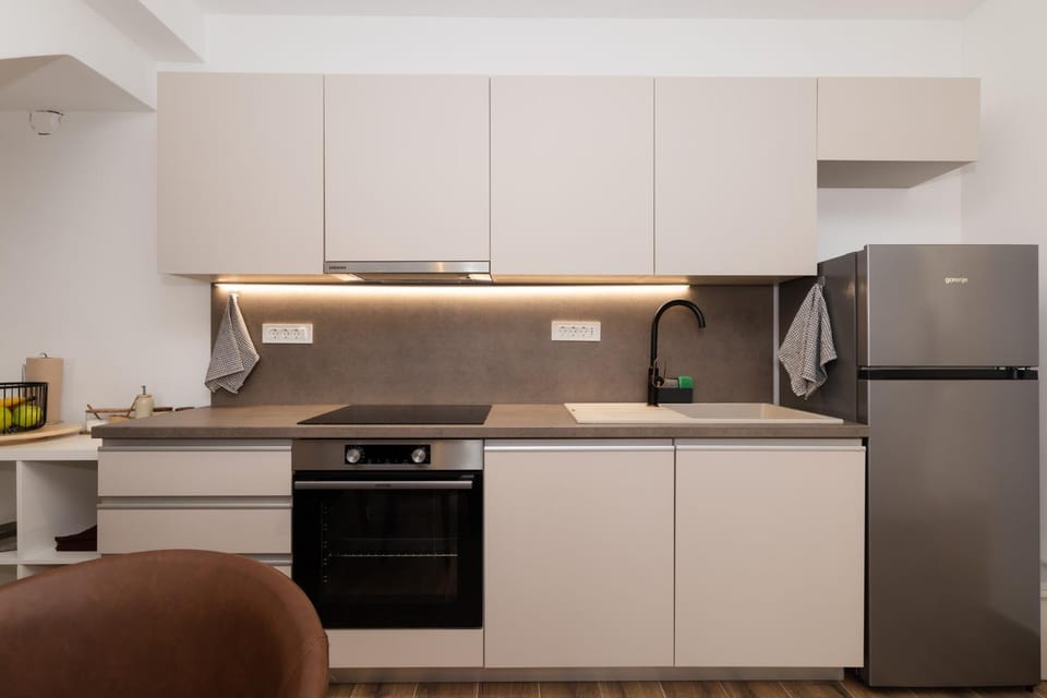 Kitchen or kitchenette, dishwasher, oven, stove, toaster