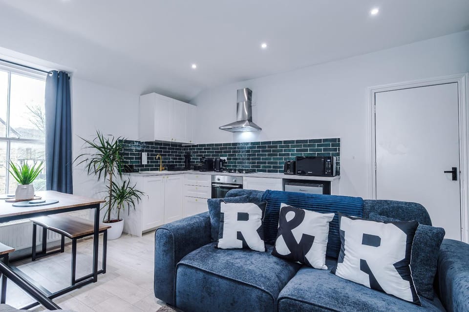 Property logo or sign, Kitchen or kitchenette, Living room, Seating area, Dining area, stove