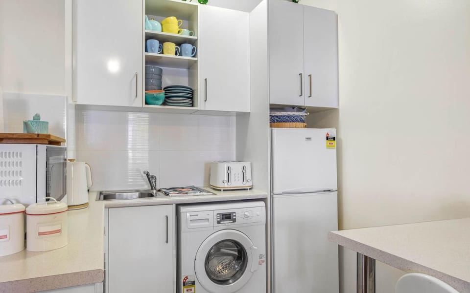Kitchen or kitchenette, washing machine
