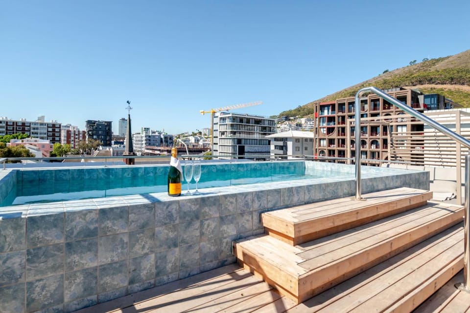 107sqm Designer Flat w/ Patio & Rooftop Pool Apartment in Sea Point