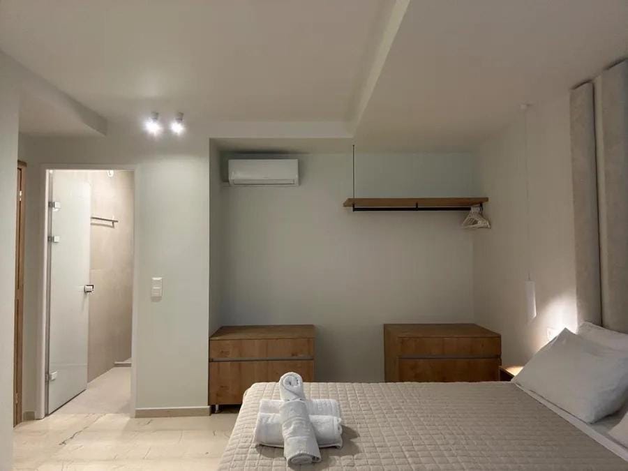 Bed, towels, wardrobe, air conditioner