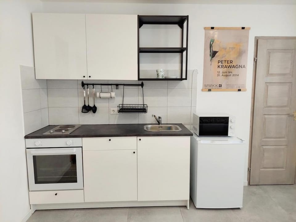 Kitchen or kitchenette, microwave, oven, stove
