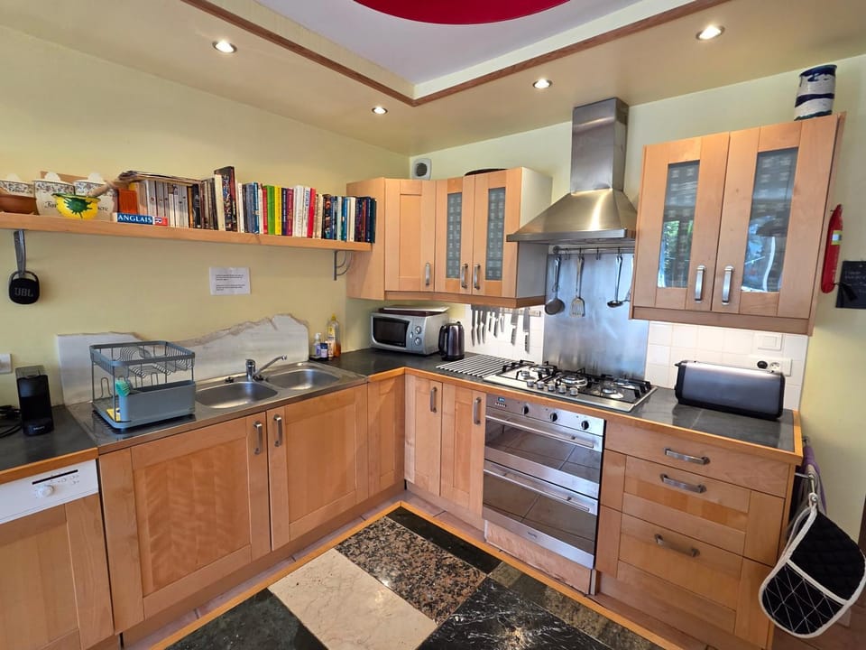 Kitchen or kitchenette, dishwasher, microwave, oven, stove, toaster