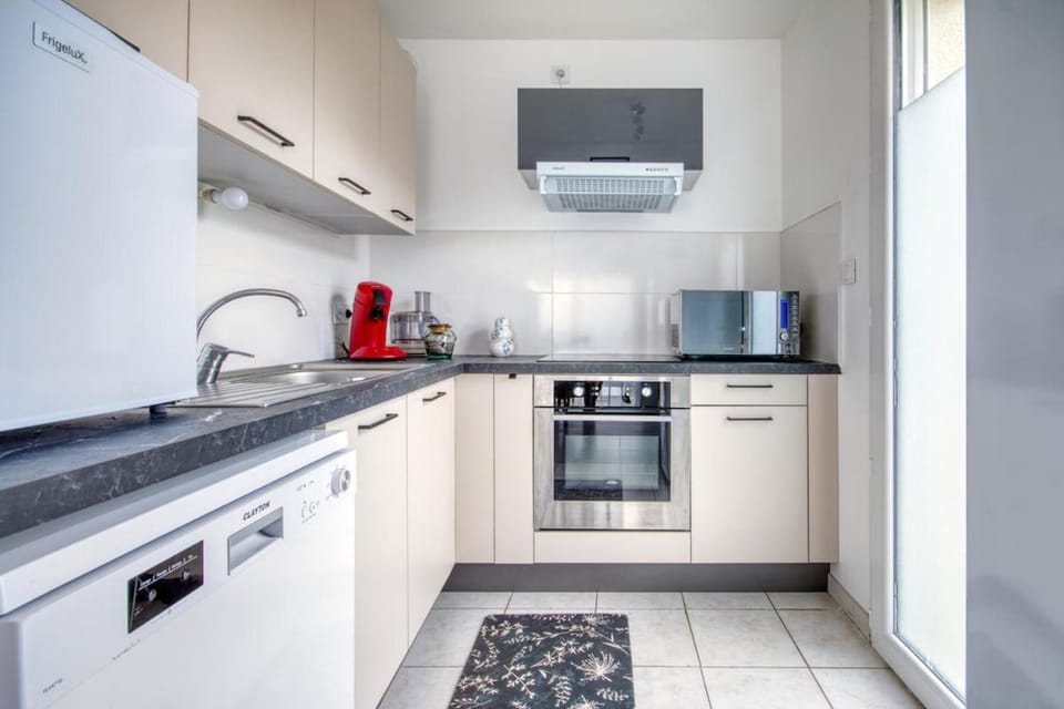 Kitchen or kitchenette, dishwasher, oven, stove