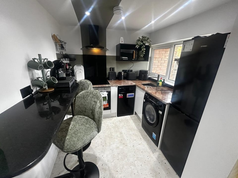 Kitchen or kitchenette, dishwasher, oven, stove, washing machine, dryer