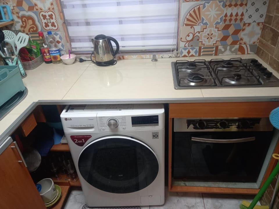 Kitchen or kitchenette, washing machine