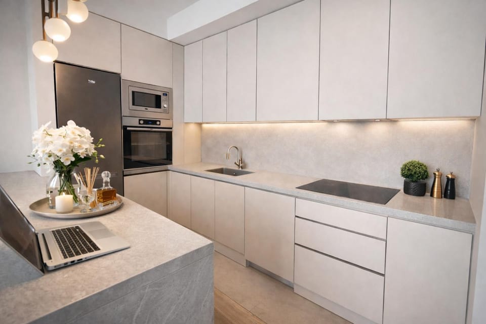 Kitchen or kitchenette, dishwasher, oven, stove