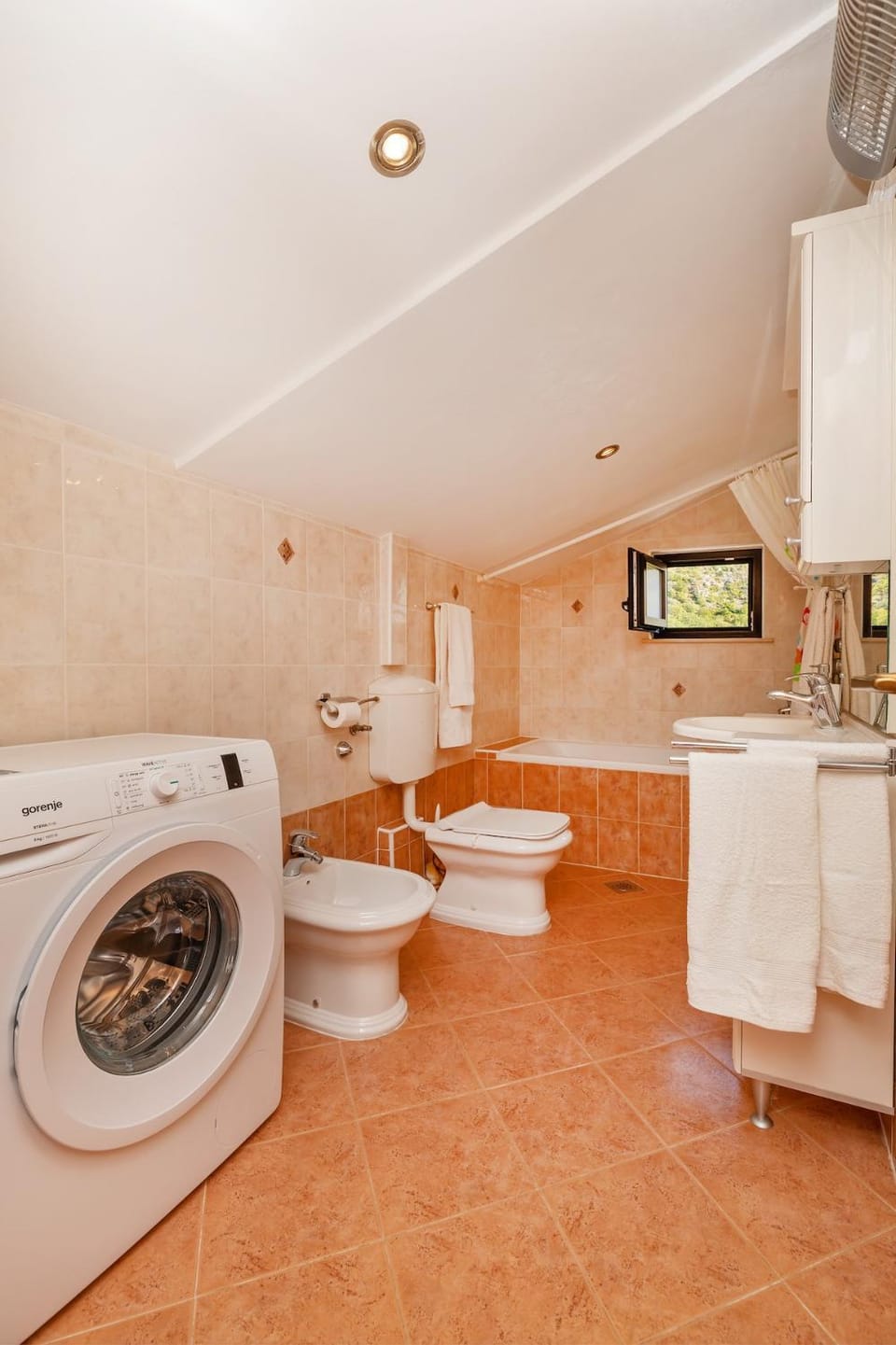 Toilet, Bathroom, bidet, towels, washing machine