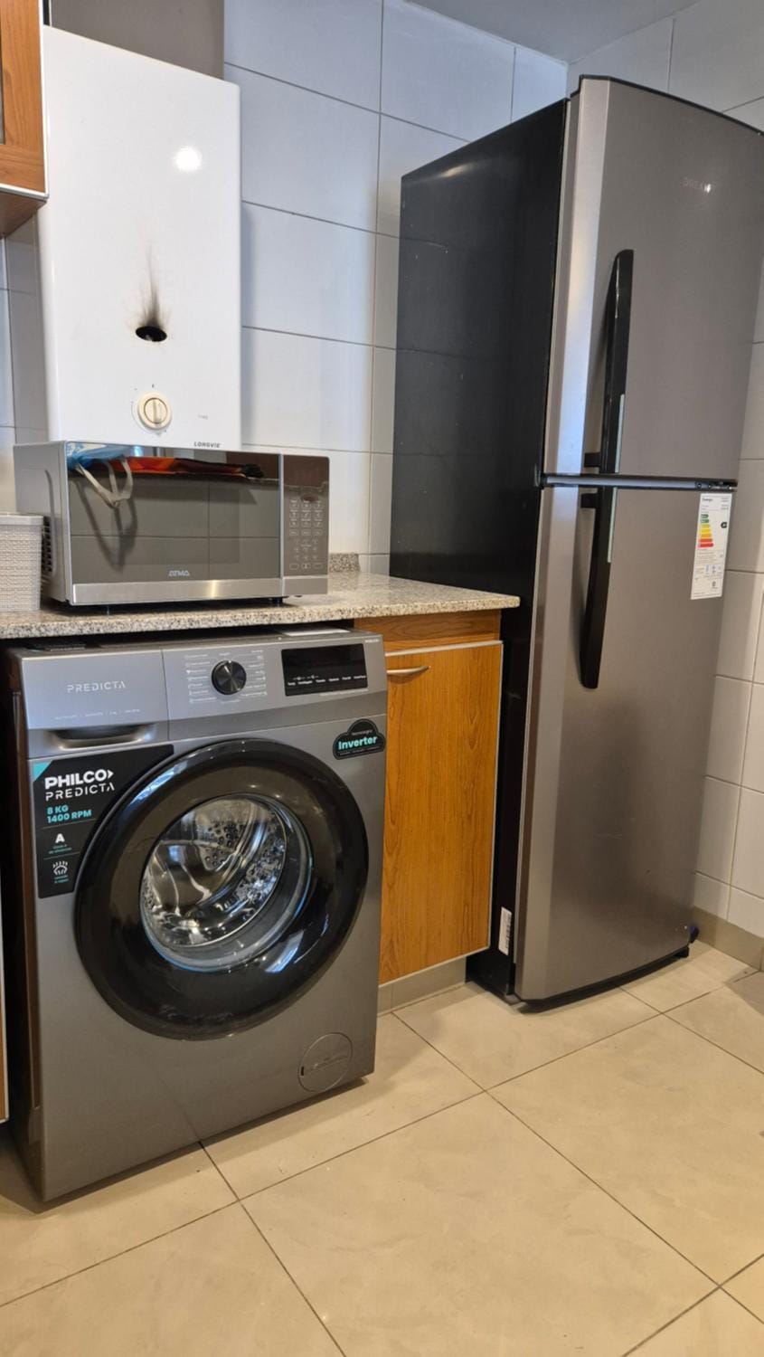 Kitchen or kitchenette, washing machine