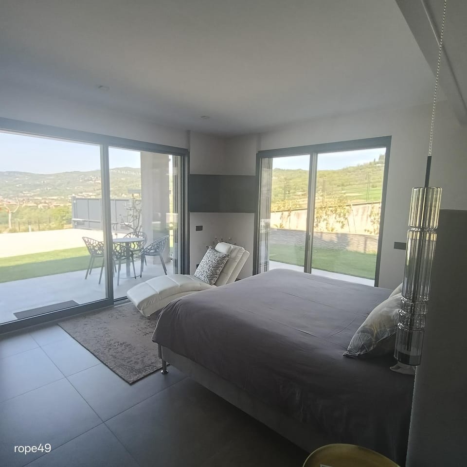 Patio, Bed, Natural landscape, Golfcourse, View (from property/room), Balcony/Terrace, Other, Photo of the whole room, Bedroom, Text overlay, Mountain view, bidet, furniture, safe, towels, air conditioner