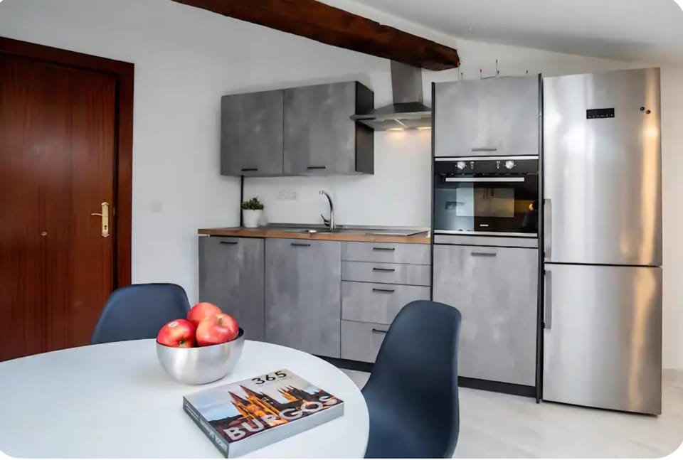 Kitchen or kitchenette, dishwasher, oven, stove