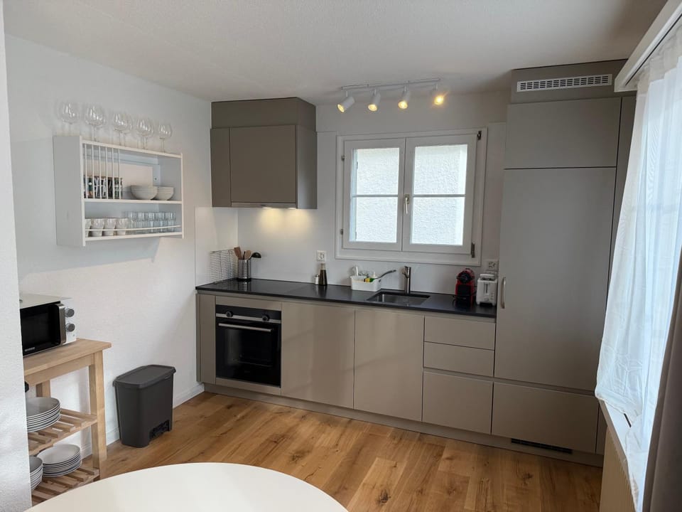 Kitchen or kitchenette, dishwasher, oven, stove, toaster