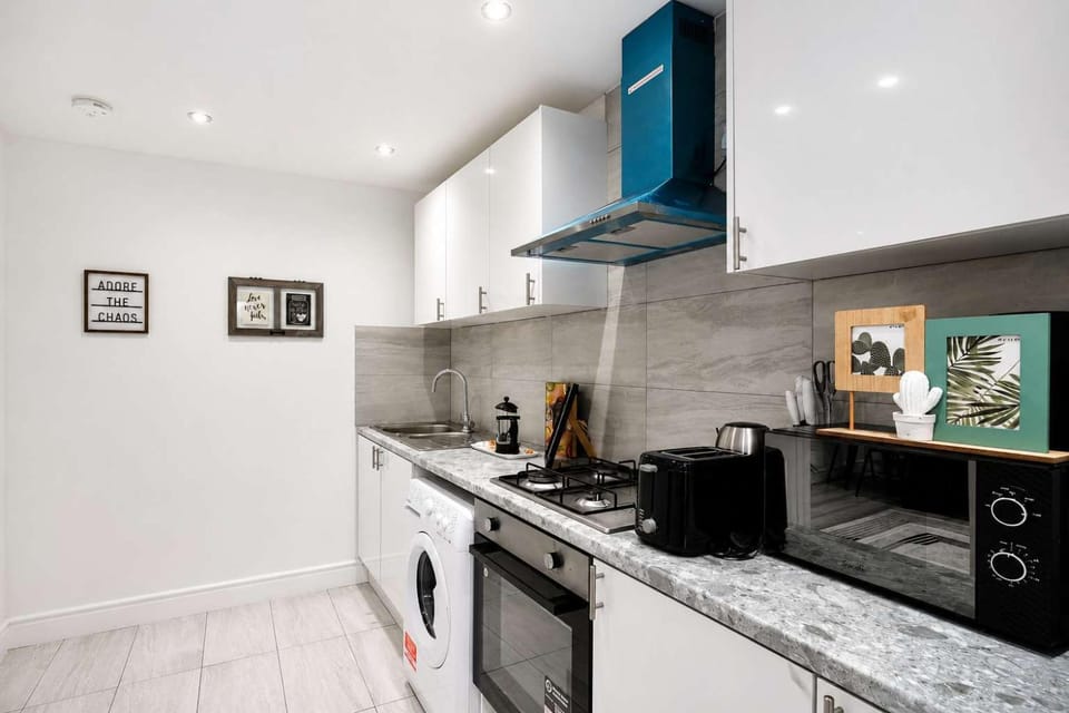 Kitchen or kitchenette, dishwasher, stove, toaster